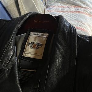 Harley Davidson mid length jacket there is no size I am an extra large